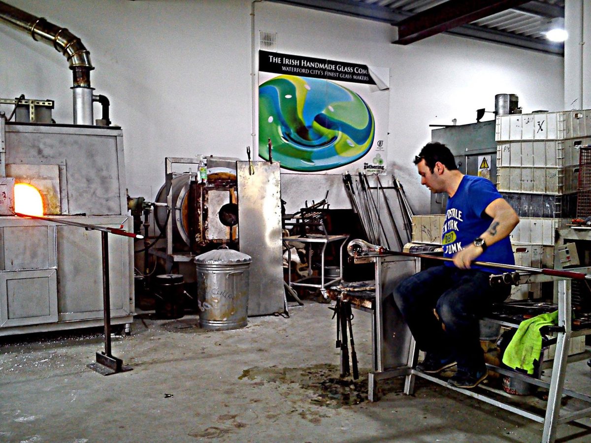 Master craftsman creating handmade crystal at The Irish Handmade Glass Company in Waterford City's Viking Triangle