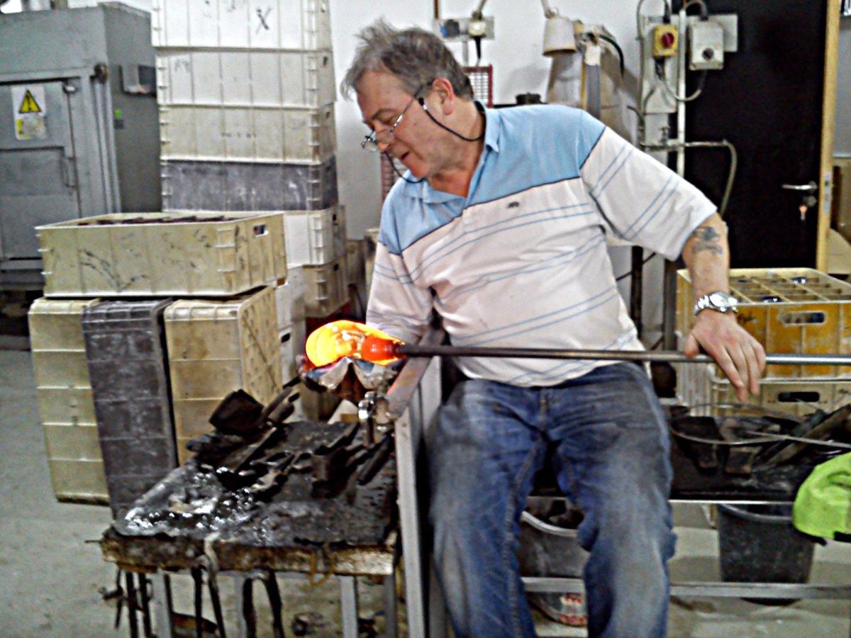 Master craftsman creating handmade crystal at The Irish Handmade Glass Company in Waterford City's Viking Triangle