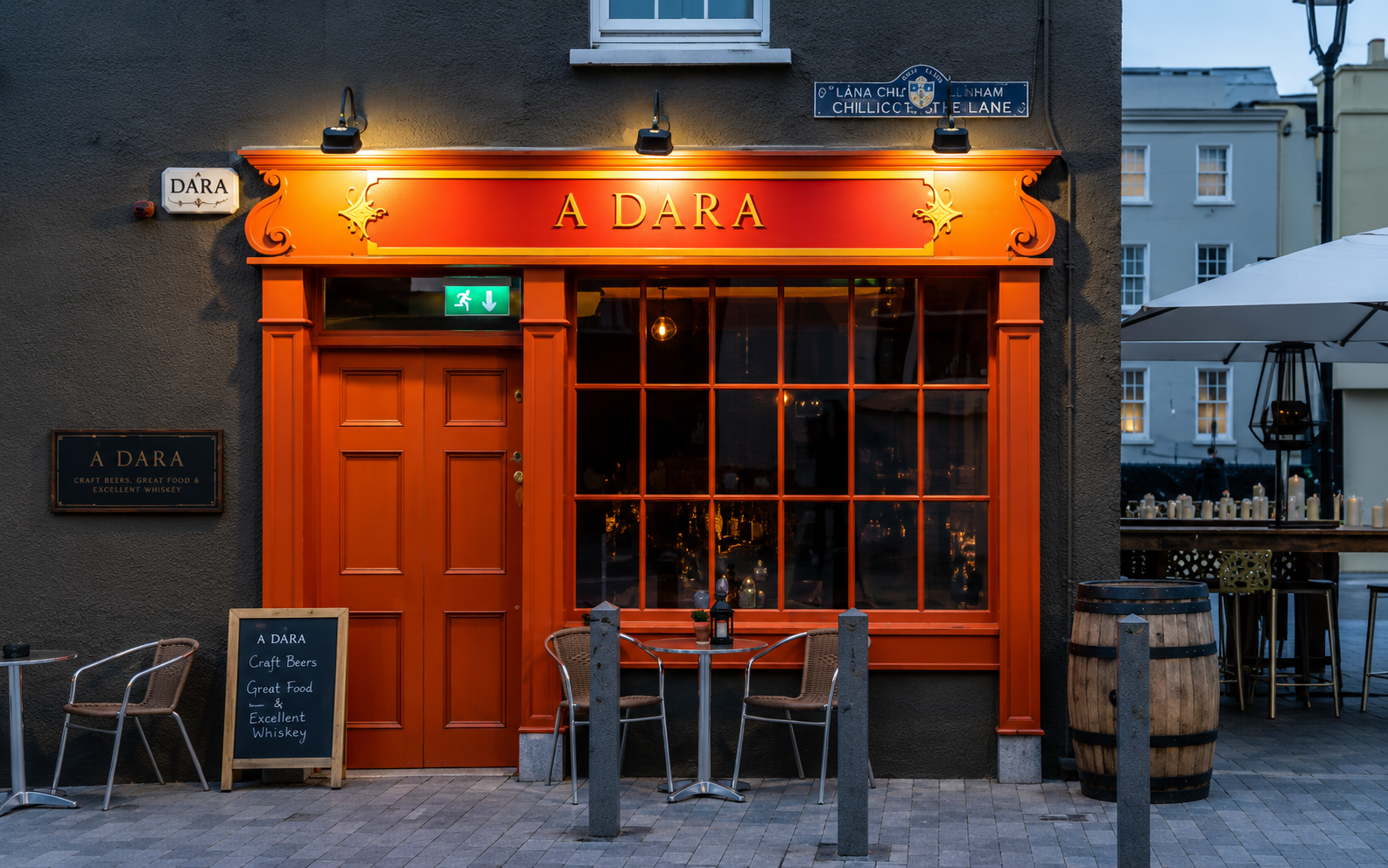 Orange frontage of Adega Wine Bar with outdoor seating