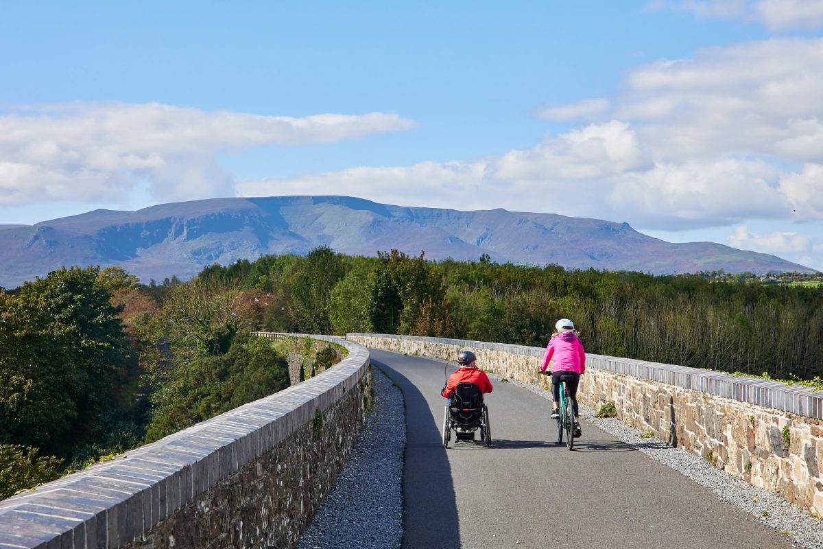 Cyclists travelling along the Waterford Greenway, the scenic 46km walking and cycling route between Waterford City and Dungarvan.