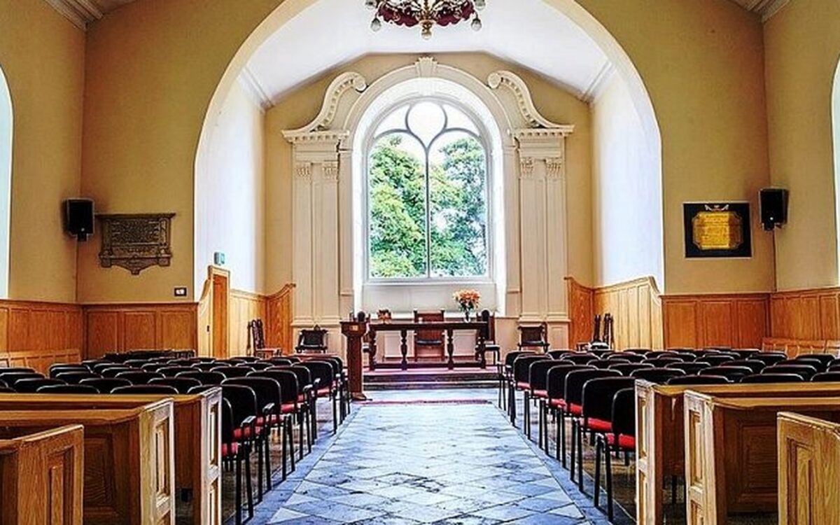Interior of St Patrick’s Gateway Centre with rows of chairs and a central aisle